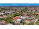 A single-story home featuring modern architecture, a terracotta roof, and Las Vegas skyline views at 853 Morning Sun Ct, Las Vegas, NV 89110