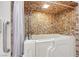 Walk-in bathtub with shower head and tiled walls; ideal for comfortable bathing at 853 Morning Sun Ct, Las Vegas, NV 89110