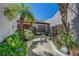 Inviting front entrance with lush landscaping and a charming walkway leading to the front door at 853 Morning Sun Ct, Las Vegas, NV 89110
