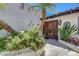 Attractive front entrance featuring a landscaped walkway leading to the ornate wooden front doors at 853 Morning Sun Ct, Las Vegas, NV 89110