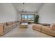 Open living room with vaulted ceiling, large sofa, and a window offering plenty of natural light at 853 Morning Sun Ct, Las Vegas, NV 89110