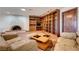 Cozy living room features a charming fireplace, custom bookshelves, and comfortable seating at 853 Morning Sun Ct, Las Vegas, NV 89110