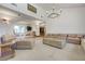 Spacious living room with comfortable seating and unique lighting fixtures at 853 Morning Sun Ct, Las Vegas, NV 89110