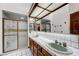Main bathroom with tiled counters, dual sinks and glass enclosed shower at 853 Morning Sun Ct, Las Vegas, NV 89110
