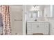 Bright bathroom featuring a shower with seashell curtain and a sink with vanity at 930 High Plains Dr, Henderson, NV 89002