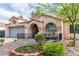Charming single-story home with a well-maintained front yard and cozy porch seating area at 930 High Plains Dr, Henderson, NV 89002