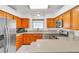 Kitchen featuring stainless steel appliances, wood cabinets and a breakfast bar at 930 High Plains Dr, Henderson, NV 89002