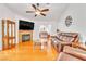 Cozy living room with fireplace, hardwood floors, and ample seating at 930 High Plains Dr, Henderson, NV 89002