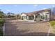 Spacious, low-maintenance backyard featuring a covered patio, desert landscaping and mountain views at 9921 Woodhouse Dr, Las Vegas, NV 89134