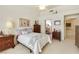 Cozy bedroom features neutral colors, a ceiling fan, and natural light creating a peaceful atmosphere at 9921 Woodhouse Dr, Las Vegas, NV 89134