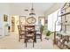 Bright dining room featuring a round table with seating for four and decorative display shelves at 9921 Woodhouse Dr, Las Vegas, NV 89134