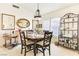 Bright dining room featuring a round table with seating for four and decorative display shelves at 9921 Woodhouse Dr, Las Vegas, NV 89134