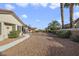 Long driveway, desert landscaping and sidewalk leading to the front door at 9921 Woodhouse Dr, Las Vegas, NV 89134