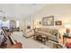 Bright living room showcasing a piano, comfortable seating, and adjacent dining area at 9921 Woodhouse Dr, Las Vegas, NV 89134