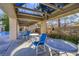 Inviting pool area featuring tables and chairs under a shaded structure, perfect for relaxation and social gatherings at 9921 Woodhouse Dr, Las Vegas, NV 89134