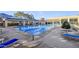 Community pool area featuring an olympic-sized pool, ample seating and shaded cabanas at 9921 Woodhouse Dr, Las Vegas, NV 89134