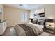 This staged bedroom features a comfortable bed, stylish furniture, and complementary modern decor at 10159 Tumbling Tree St, Las Vegas, NV 89183