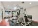 Large exercise room with multiple machines and ceiling fans at 10159 Tumbling Tree St, Las Vegas, NV 89183