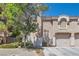 Charming two-story townhome featuring a well-maintained front yard and attached two-car garage at 10159 Tumbling Tree St, Las Vegas, NV 89183