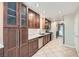 Updated kitchen with wood cabinetry, stainless steel appliances, and tile flooring at 10159 Tumbling Tree St, Las Vegas, NV 89183