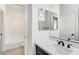 Bathroom featuring a sink, a mirror, and a view of the shower and toilet at 1124 Coral Rainbow Ave, Las Vegas, NV 89123