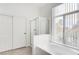 Bathroom featuring a soaking tub and a glass enclosed shower at 1124 Coral Rainbow Ave, Las Vegas, NV 89123
