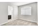 Bedroom featuring carpet, a window, and a view into the attached bathroom at 1124 Coral Rainbow Ave, Las Vegas, NV 89123