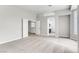 Large bedroom featuring neutral carpet and access to a private bathroom at 1124 Coral Rainbow Ave, Las Vegas, NV 89123