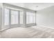 Spacious living room with ample natural light and neutral carpet at 1124 Coral Rainbow Ave, Las Vegas, NV 89123