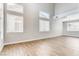 Bright living room with high ceilings, tile floors, and large windows letting in lots of light at 1124 Coral Rainbow Ave, Las Vegas, NV 89123