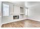 Open living room with fireplace, wood-look flooring, and recessed lighting at 1124 Coral Rainbow Ave, Las Vegas, NV 89123