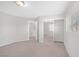 Bedroom with neutral walls, carpeted floor, and closet with sliding mirror doors at 11273 Accademia Ct, Las Vegas, NV 89141