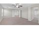 Large carpeted bedroom with an ensuite bathroom visible, offering a tranquil retreat at 11273 Accademia Ct, Las Vegas, NV 89141