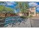 Charming two-story home featuring a spacious driveway and desert landscaping at 11273 Accademia Ct, Las Vegas, NV 89141