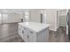 Open kitchen featuring a center island with quartz countertop and stainless steel appliances at 11273 Accademia Ct, Las Vegas, NV 89141