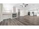 Open living space with fireplace and stairs, leading to the kitchen at 11273 Accademia Ct, Las Vegas, NV 89141