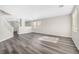 Spacious living room with modern gray flooring and staircase at 11273 Accademia Ct, Las Vegas, NV 89141