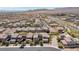 Expansive aerial view of a well-maintained neighborhood with desert landscaping and mountain views at 12273 Catanzaro Ave, Las Vegas, NV 89138