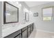 Bathroom with double sinks and vanity with quartz countertops at 12273 Catanzaro Ave, Las Vegas, NV 89138