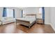 Spacious main bedroom featuring hardwood floors, a king bed, and cozy furniture at 12273 Catanzaro Ave, Las Vegas, NV 89138