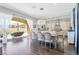 Elegant dining room with hardwood floors and access to the patio/pool area at 12273 Catanzaro Ave, Las Vegas, NV 89138