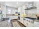Modern kitchen with stainless steel appliances, granite countertops, and custom cabinetry at 12273 Catanzaro Ave, Las Vegas, NV 89138