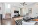Spacious living room with dark hardwood floors, recessed lighting, and comfortable seating at 12273 Catanzaro Ave, Las Vegas, NV 89138