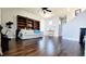Spacious living room featuring hardwood floors and a large bookshelf at 12273 Catanzaro Ave, Las Vegas, NV 89138