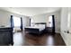 Large main bedroom with a dark wood furniture set and nice windows at 12273 Catanzaro Ave, Las Vegas, NV 89138