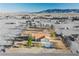Expansive aerial view of desert home with an orange roof and mountain views at 1601 Iguana St, Pahrump, NV 89048