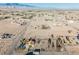 Scenic aerial shot of desert landscape featuring neighborhood homes with mountain backdrop at 1601 Iguana St, Pahrump, NV 89048