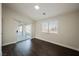 Comfortable bedroom with wood-look flooring, sliding glass doors and ample lighting at 1601 Iguana St, Pahrump, NV 89048
