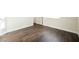 Bedroom with wood-look flooring, neutral walls, and bright natural light at 1601 Iguana St, Pahrump, NV 89048
