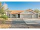 A charming home showcasing a well-manicured lawn, an orange roof, and a spacious three-car garage at 1601 Iguana St, Pahrump, NV 89048